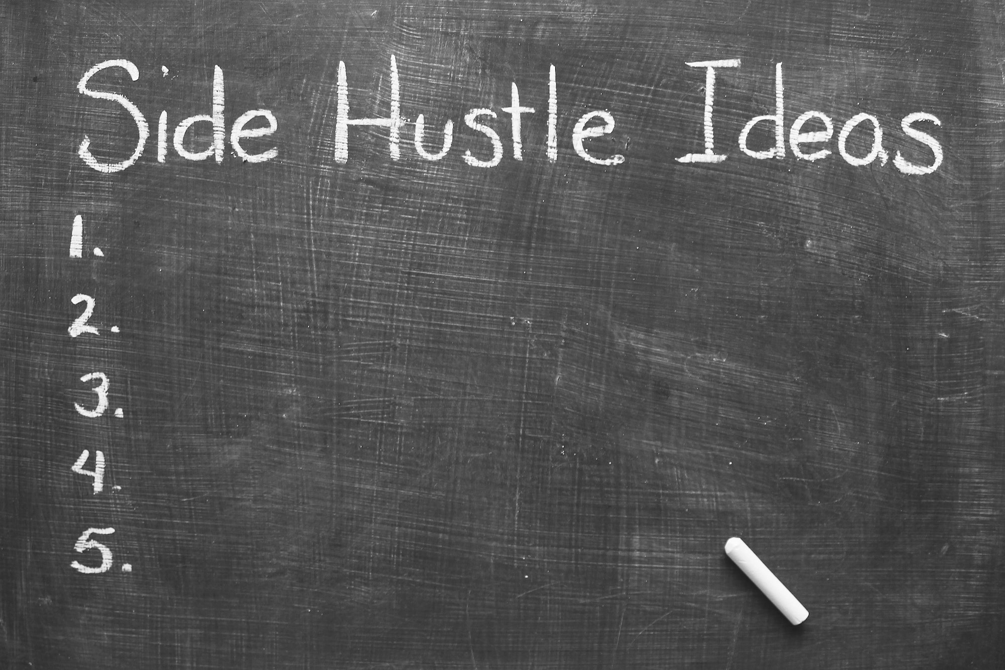 Side hustle ideas written on chalkboard