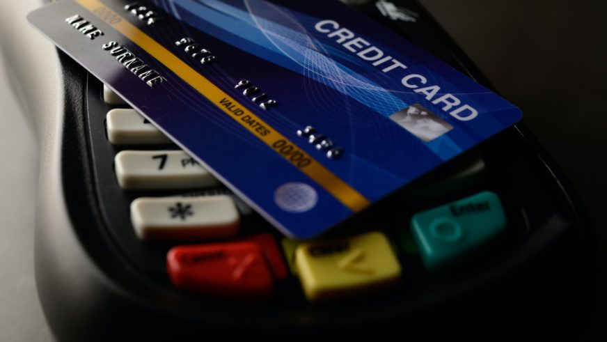 Credit cards placed on credit card swipes