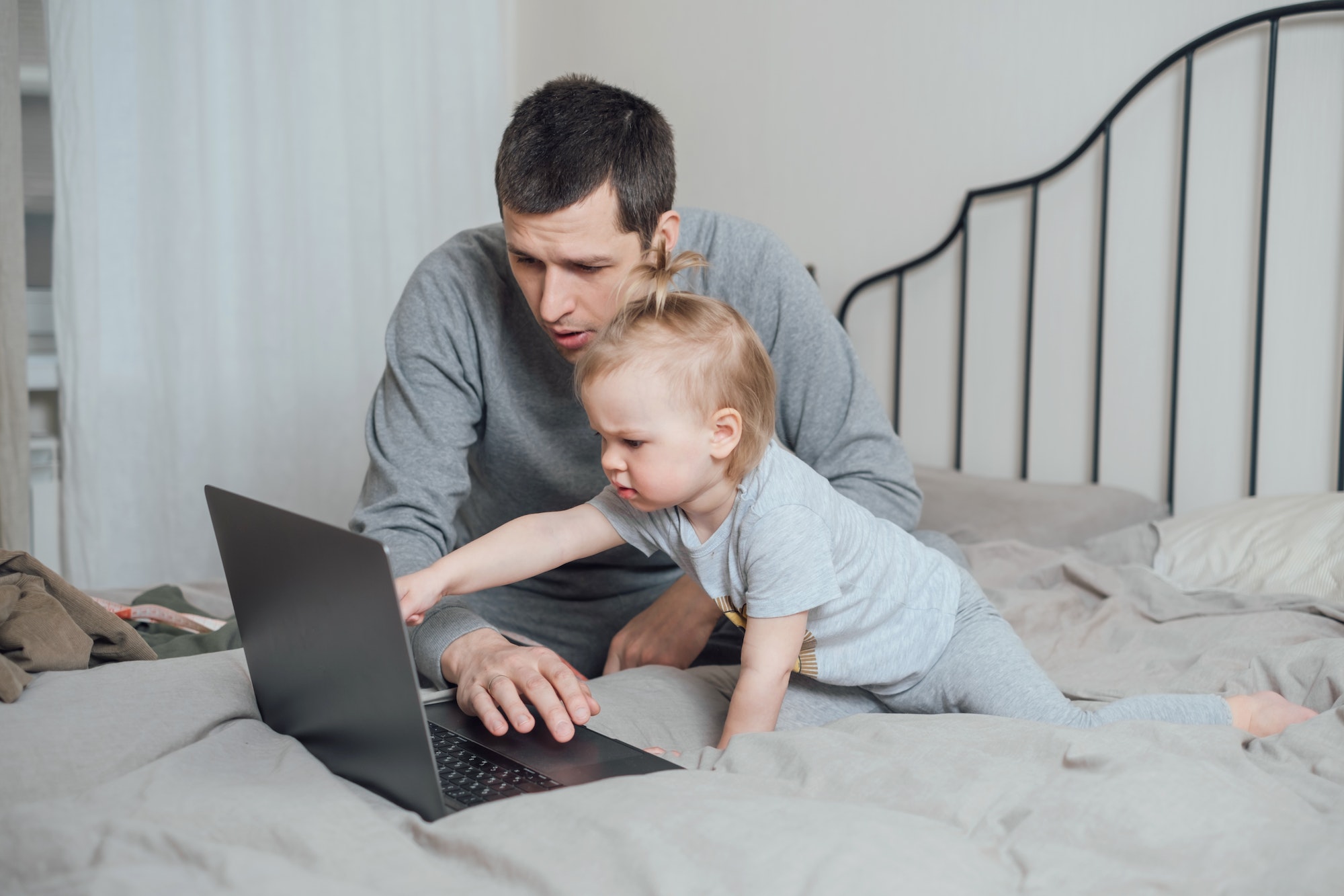 Dad and daughter choose something on the Internet through a computer