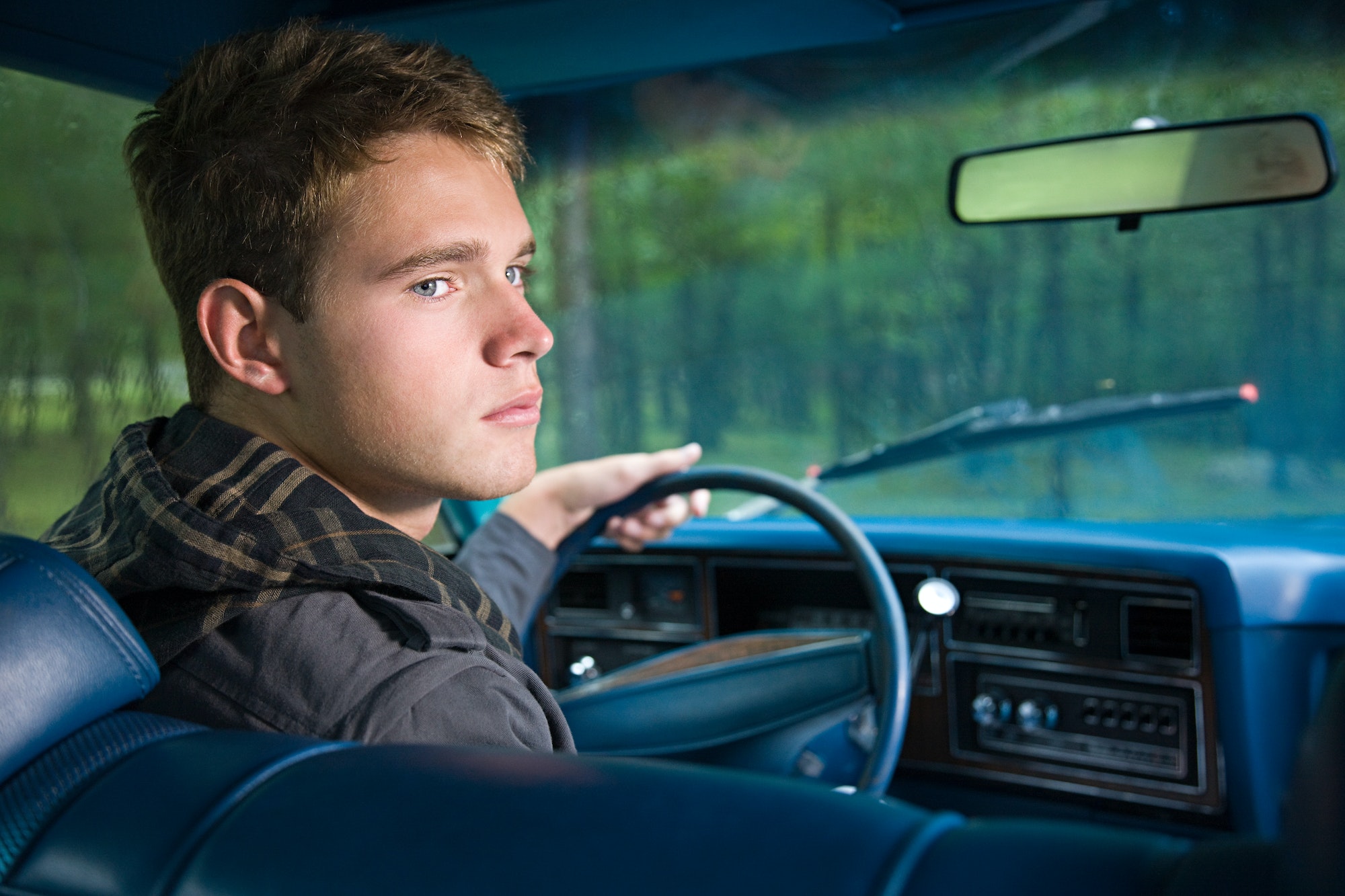 Teenage boy in car