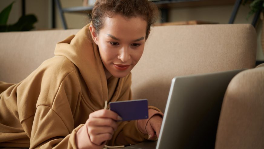 Woman paying online with credit card