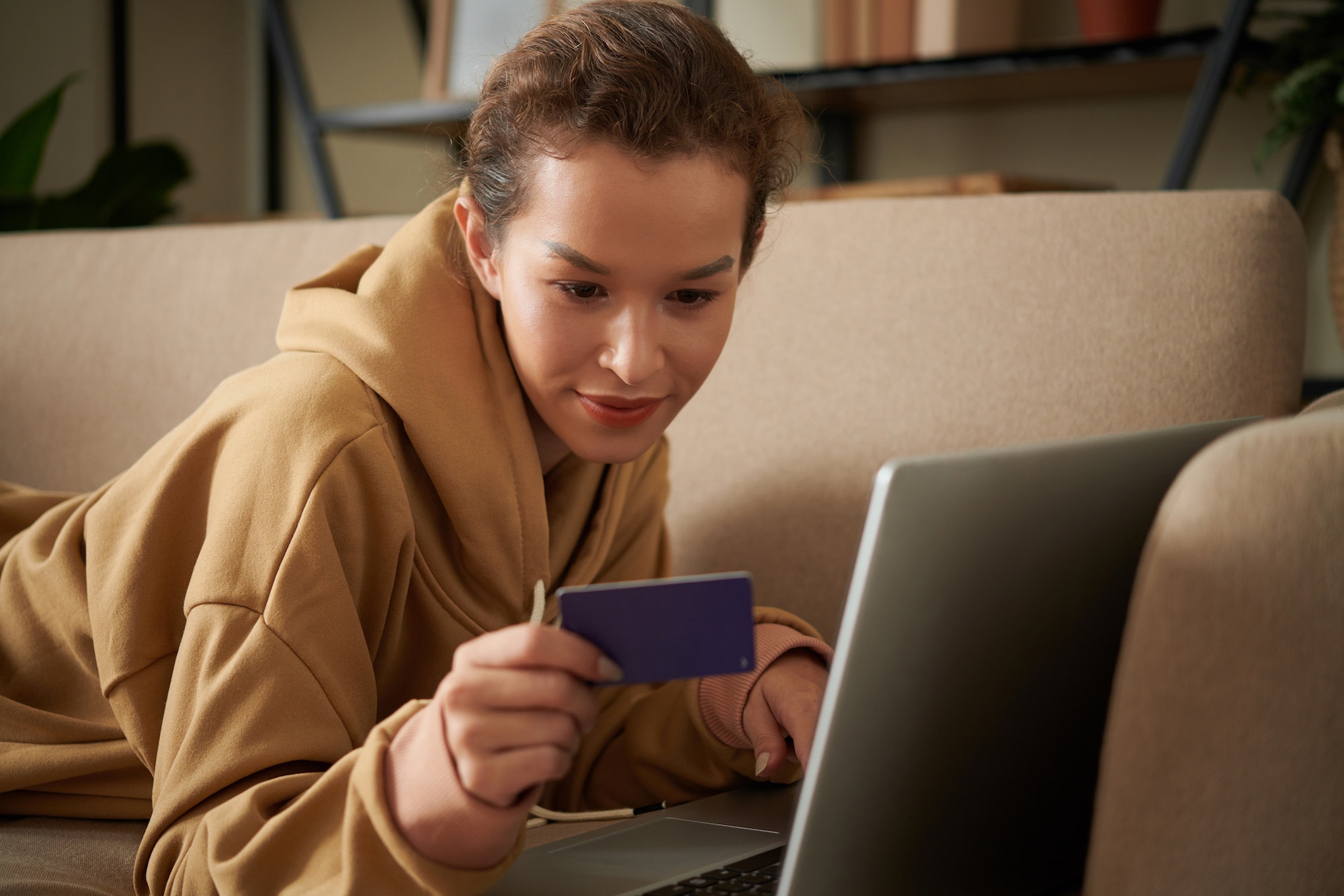 Woman paying online with credit card