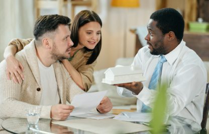 Young couple with mortgage consultant